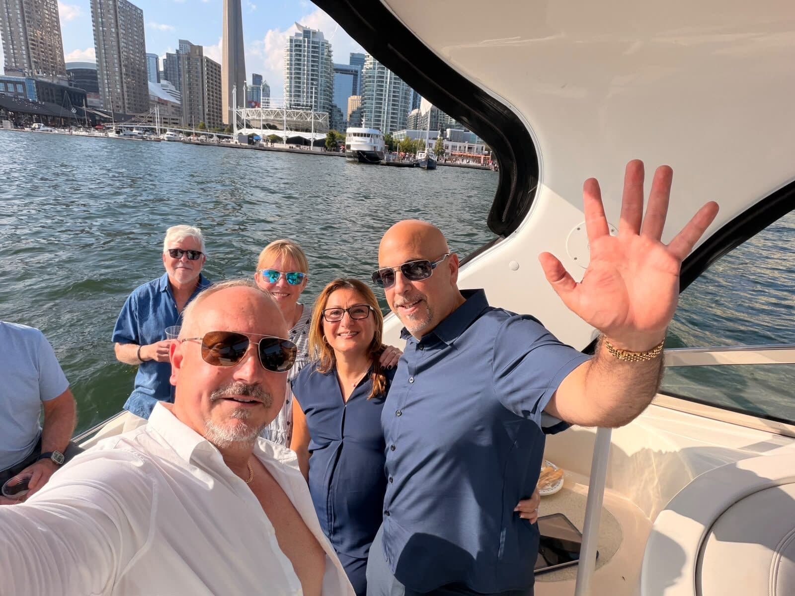 The team on the water with the Toronto skyline behind them