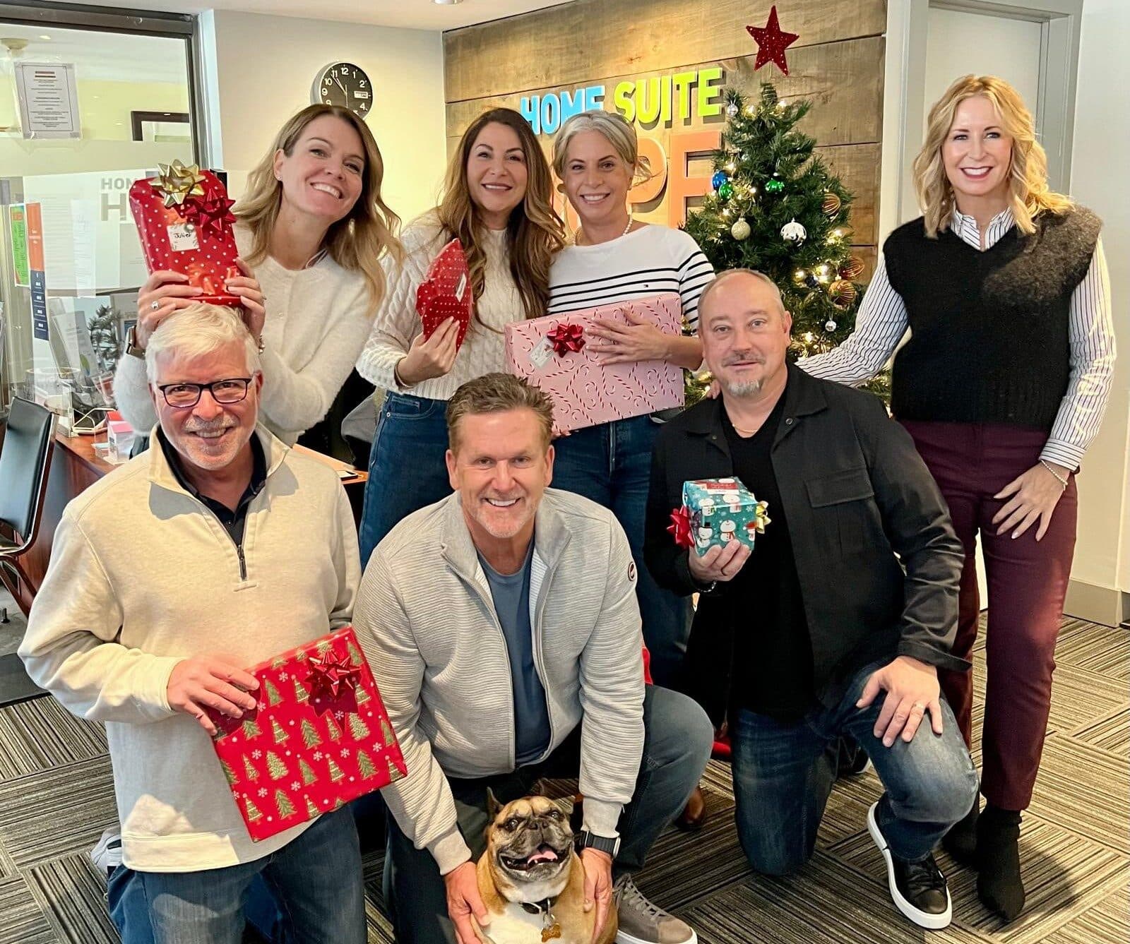 The team at a holiday giving event