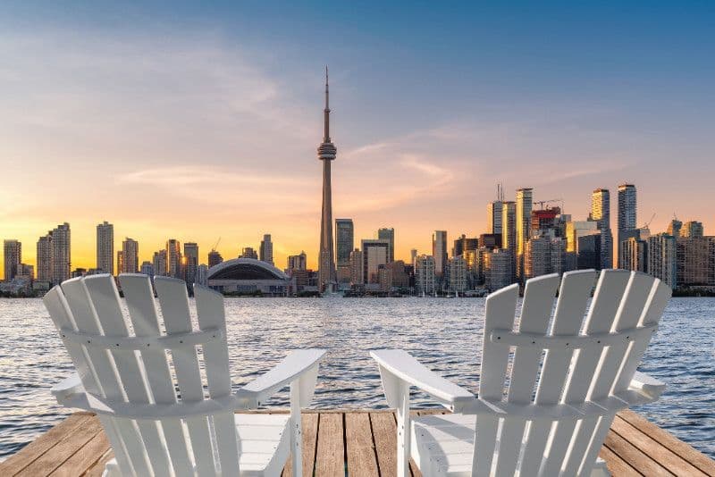 Adirondack chairs by the water in The Beaches, Toronto.